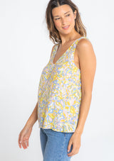 [Color: Blue/Lemon] A model wearing a blue and yellow vintage inspired retro floral print tank top. 