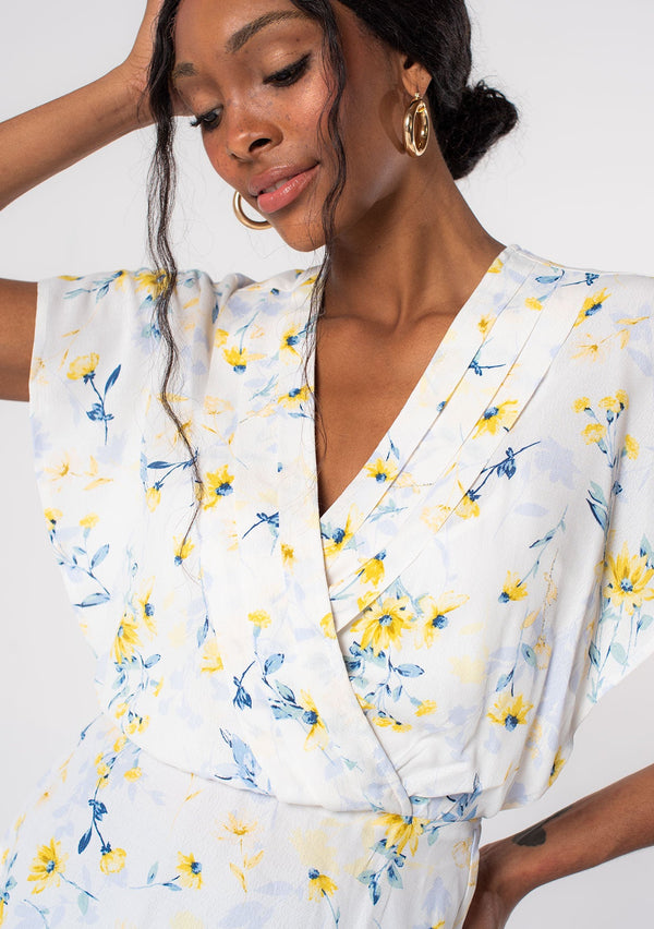 [Color: Cream/Yellow] A flowy bohemian short sleeve blouse in a cream and yellow sunflower floral print. Designed in Los Angeles, available in XS through XL.
