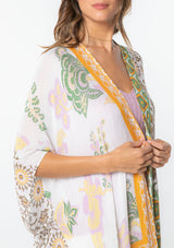 [Color: Taupe/Off White] A model wearing a yellow and white mixed bohemian print kimono. 