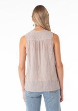 [Color: Dove] A back facing image of a blonde model wearing a spring sleeveless blouse in a grey eyelet lace chiffon. With a button front, a split v neckline, and a relaxed fit.