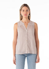 [Color: Dove] A front facing image of a blonde model wearing a spring sleeveless blouse in a grey eyelet lace chiffon. With a button front, a split v neckline, and a relaxed fit.