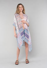 [Color: Ivory/Light Rose] A front facing image of a blonde model wearing a lightweight bohemian mid length kimono in an ivory and light pink mixed floral border print. With half length kimono sleeves, an open front, and side slits. 