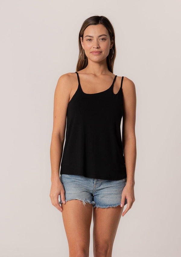 [Color: Black] A front facing image of a brunette model wearing a black stretchy bamboo knit tank top with asymmetric spaghetti straps, a scoop neckline, and a relaxed slim fit.