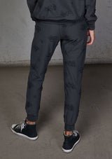 [Color: Charcoal] Relaxed, super soft jogger pants with cool distressed details. Featuring essential side pockets, a slightly tapered leg, and an elastic waistband.
