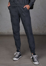 [Color: Charcoal] Relaxed, super soft jogger pants with cool distressed details. Featuring essential side pockets, a slightly tapered leg, and an elastic waistband.