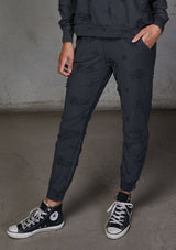 [Color: Charcoal] Relaxed, super soft jogger pants with cool distressed details. Featuring essential side pockets, a slightly tapered leg, and an elastic waistband.