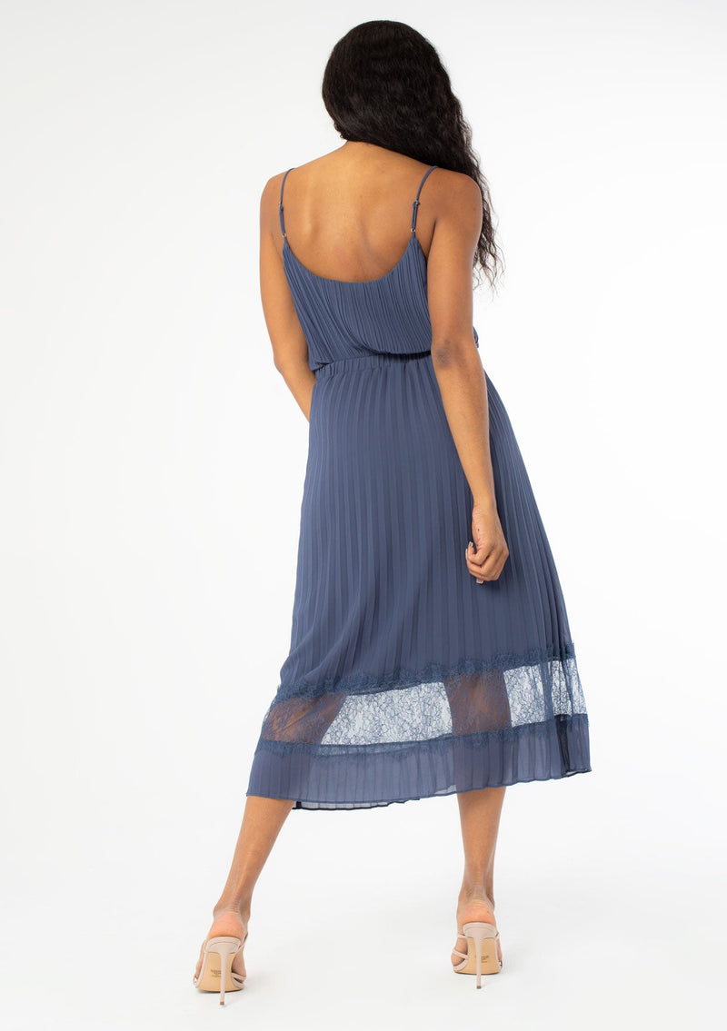 [Color: Steel Blue] A sunburst pleated mid length skirt. Featuring a delicate eyelash lace trim insert at the bottom of the skirt, an elastic waist, and elegant pleating throughout.