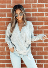 [Color: Grey Confetti] Speckled cross front sweater. Featuring a flattering v neckline and a whimsical confetti speckle throughout.
