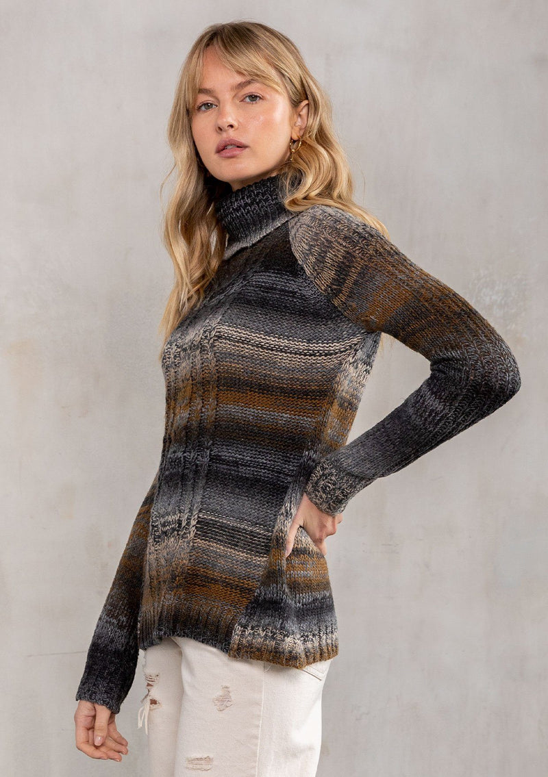 [Color: Charcoal Multi] A soft striped turtleneck sweater. A rustic yarn dye pullover featuring a cable knit detail in the front.