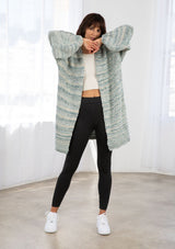 [Color: Seafoam Multi] A timeless classic, this effortlessly cool chunky melange knit cardigan features flattering voluminous balloon sleeves, a relaxed and cozy silhouette, and the perfect mid length hemline.