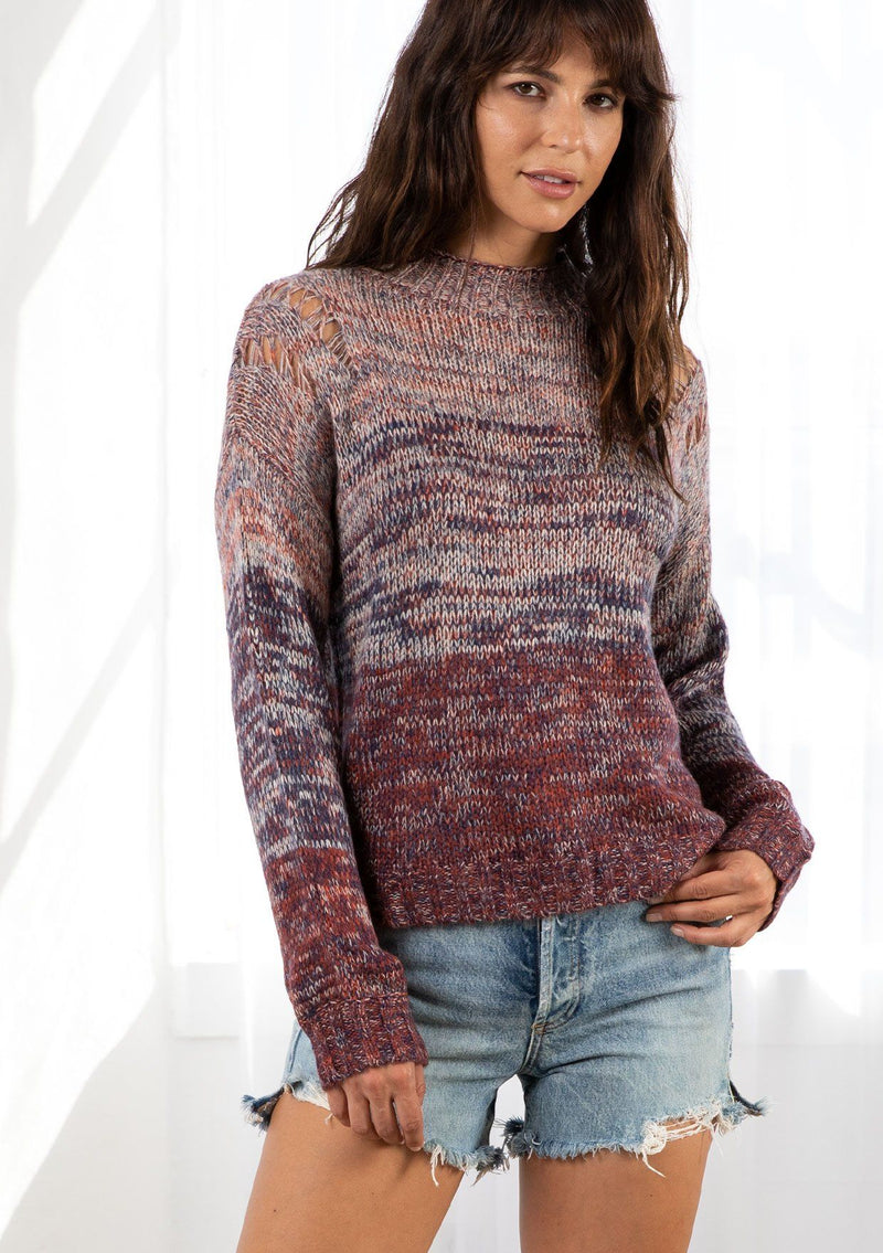 [Color: Cranberry Multi] A model wearing an Ombre space dye knit sweater. Featuring a chic mock neck and open knit details along the shoulder.