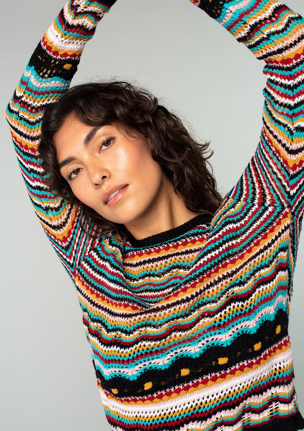 [Color: Black Multi] A multi colored striped sweater. Featuring a bold multi color pattern, delicate open knit crochet, and contrast trim.