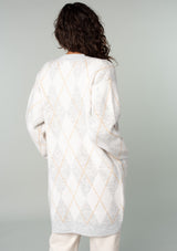 [Color: Heather Grey/Ivory] A back facing image of a brunette model wearing an ultra soft mid length cardigan in a light grey and ivory argyle plaid pattern. With long sleeves, an open front, and side pockets. 