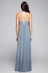 [Color: Slate Blue/Vanilla] A back facing image of a brunette woman wearing a printed light blue v neck maxi dress with a strappy back.