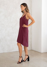 [Color: Wine] A beautiful maroon mid length slip dress. Featuring an intricate lace trim v neckline and racerback. 