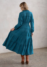 [Color: Teal] A stunning maxi peasant dress. A classic bohemian silhouette featuring a button up front, a smocked elastic waist for definition, and voluminous long sleeves.