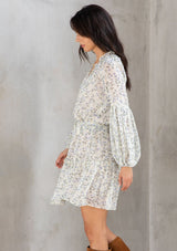 [Color: Cream/Sky] Lovestitch cream/sky Floral printed, smocked waist mini dress with volume sleeves and tassel tie neck.