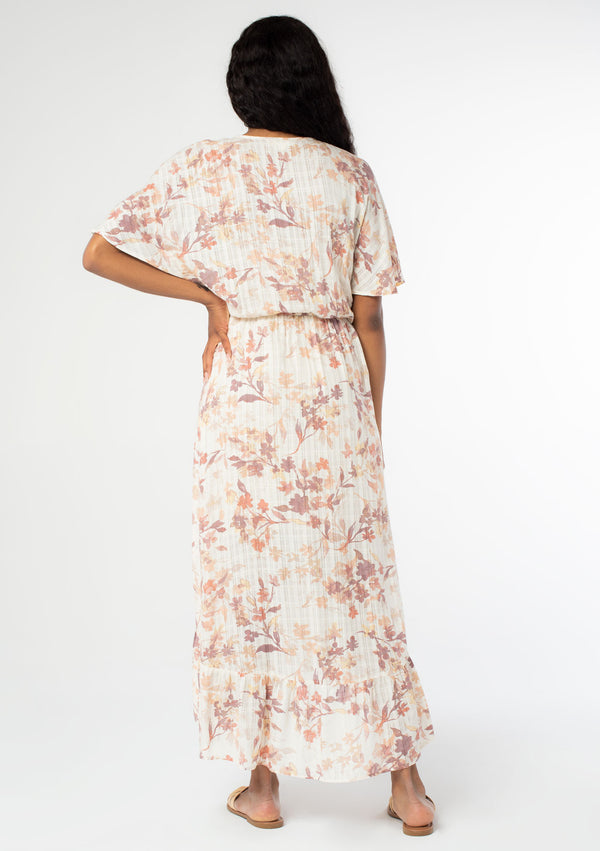 [Color: Peach Ivory] Beautiful and ultra feminine maxi dress featuring half length flutter sleeve and flirty ruffle hem. Soft and pretty floral print.