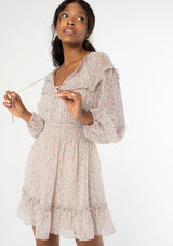 [Color: Blush Ivory] Ultra feminine and flirty sheer ditsy floral mini dress. Featuring a smocked elastic waist, long volume sleeves and elastic cuffs.