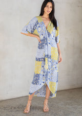 [Color: Blue/Lime] Just in time for spring, this vacation-ready maxi dress is designed in lightweight, multi-colored crinkled gauze. Featuring a bohemian blue and lime green floral patchwork print and a twist front detail at the waist, we're wearing this versatile maxi with a cool statement earring and strappy heel. Feeling beachy? Throw it on over your swimsuit for a casual, post-beach vibe. Available in XS - XL.
