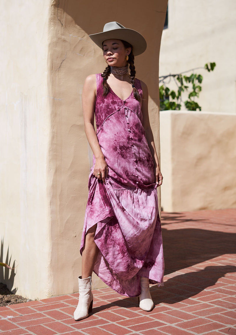 [Color: Berry] A beautiful maxi dress in dreamy tie dye. Featuring a delicate self covered button up front, a flattering v neckline, and a feminine tiered skirt.