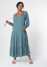 [Color: Sea Green] A model wearing a versatile aqua blue bohemian maxi dress. Features a classic peasant dress silhouette, a relaxed fit, and delicate textured dot details throughout.