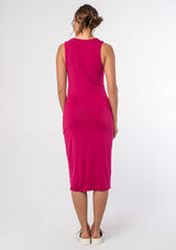 [Color: Mulberry] A model wearing a soft and stretchy slim fit sleeveless pink midi dress. With a scooped neckline and a cutout detail along the shoulder.