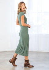 [Color: Army Green] A model wearing a soft and stretchy bamboo micro rib army green mid length dress. With short cap sleeves, a side slit, a round neckline, and a slim fit. 