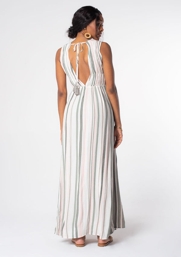 [Color: Off White/Olive] A woman wearing a bohemian sleeveless striped maxi dress in an olive green and white stripe. With a plunging v neckline and gold metallic thread detail. 
