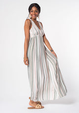 [Color: Off White/Olive] A woman wearing a bohemian sleeveless striped maxi dress in an olive green and white stripe. With a plunging v neckline and gold metallic thread detail. 