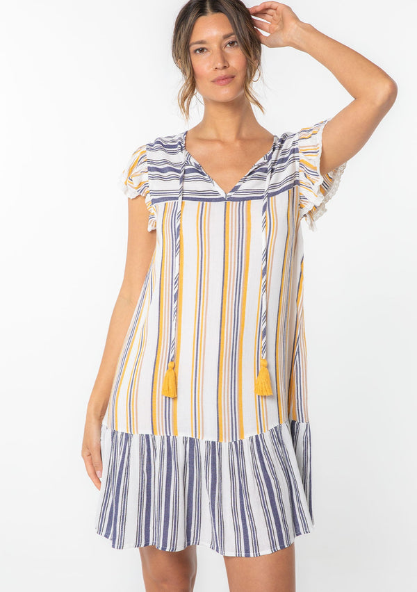 [Color: Dijon/Navy] A model wearing a flirty Summer mini dress in a navy and yellow stripe. With short flutter sleeves and a tiered skirt.