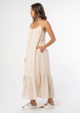 [Color: Vanilla] An ultra flowy off white bohemian sleeveless maxi dress with a strappy tie back and side pockets. 