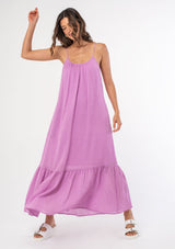 [Color: Orchid] An ultra flowy purple bohemian sleeveless maxi dress with a strappy tie back and side pockets. 