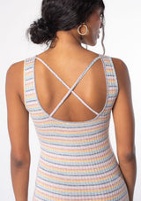 [Color: Mustard/Mint] A model wearing a pink, green, and yellow striped knit slim fit tank dress with a cross back strap detail and a scooped neckline. 
