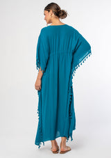 [Color: Teal] A woman wearing a sheer teal bohemian beach cover up maxi dress with lace and tassel trim and side slits. A kimono kaftan maxi dress perfect for vacations! 