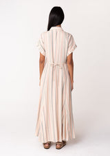 [Color: Natural/Sage] A back facing image of a brunette model wearing a bohemian flowy maxi shirt dress in a natural and sage green stripe. With short cuffed sleeves, a button front, a collared neckline, side pockets, a paneled skirt, and a back waist tie.