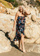[Color: Black/Coral] A tropical floral print skirt set. With a cropped tube top and a mid length wrap skirt.