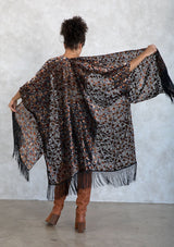 [Color: Rust Multi] A sultry, sheer velvet burnout floral kimono featuring side slits and a long fringe hemline. A bohemian cover up. 