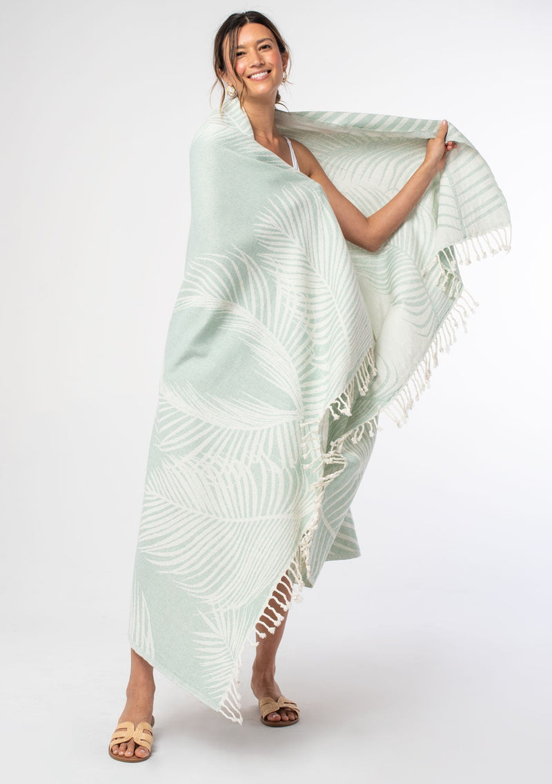 [Color: Teal/Natural] A light teal palm print bohemian cotton beach blanket throw.