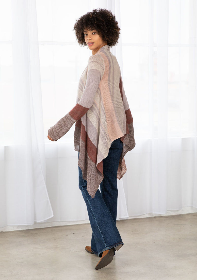 [Color: Brown/Oatmeal] A model wearing a brown and oatmeal mélange stripe cardigan. With long sleeves, a waterfall hemline, an open front, and a lightweight relaxed fit. 