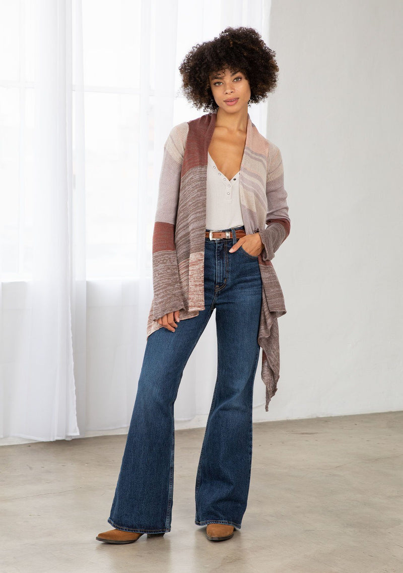 [Color: Brown/Oatmeal] A model wearing a brown and oatmeal mélange stripe cardigan. With long sleeves, a waterfall hemline, an open front, and a lightweight relaxed fit. 