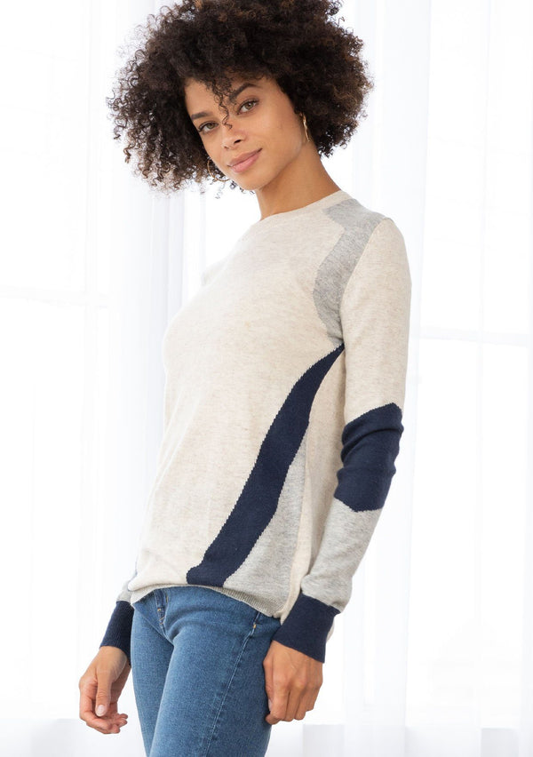 [Color: Oat Silver] A neutral toned color block sweater featuring a striped asymmetrical design, a classic crew neckline, and contrast ribbed detail.