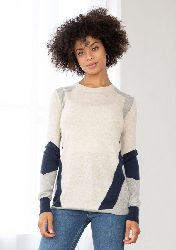 [Color: Oat Silver] A neutral toned color block sweater featuring a striped asymmetrical design, a classic crew neckline, and contrast ribbed detail.