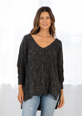 [Color: Charcoal/Silver] Lovestitch oversized, deep V-neck, black chunky knit sweater with subtle metallic accents, reverse seam detail and a high-low hem.