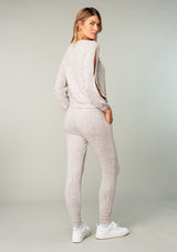 [Color: Heather Oatmeal] Girl wearing cozy knit lounge pants.