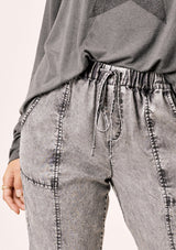 [Color: Acid Black] Lovestitch acid indigo wash jogger pant with seamed detail and elastic drawstring waist.