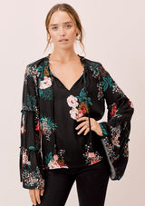[Color: Black] Lovestitch black Floral printed, bell sleeve, bohemian top with tie neck and ruffle details. 