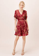 [Color: Burgundy] Ultra feminine floral mini wrap dress. A soft and silky wrap dress features a tie sleeve detail and a flattering v neckline.