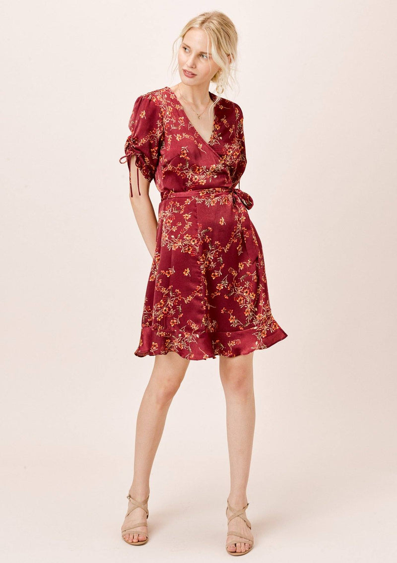 [Color: Burgundy] Ultra feminine floral mini wrap dress. A soft and silky wrap dress features a tie sleeve detail and a flattering v neckline.