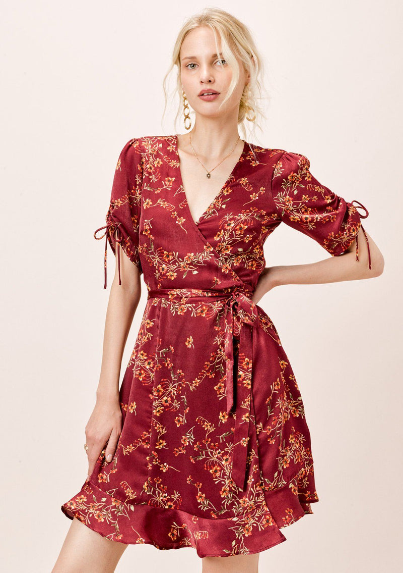 [Color: Burgundy] Ultra feminine floral mini wrap dress. A soft and silky wrap dress features a tie sleeve detail and a flattering v neckline.
